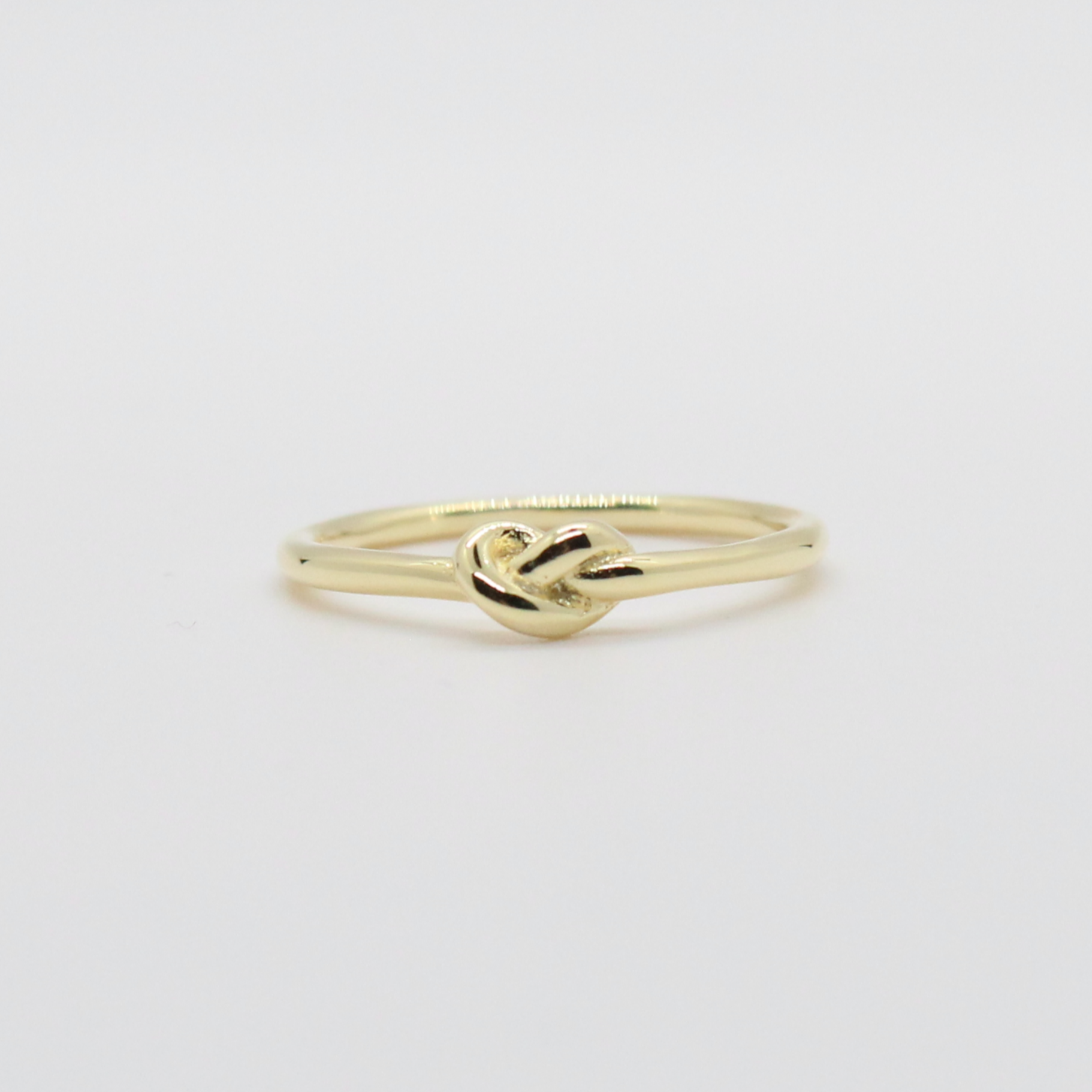 Dainty knot clearance ring